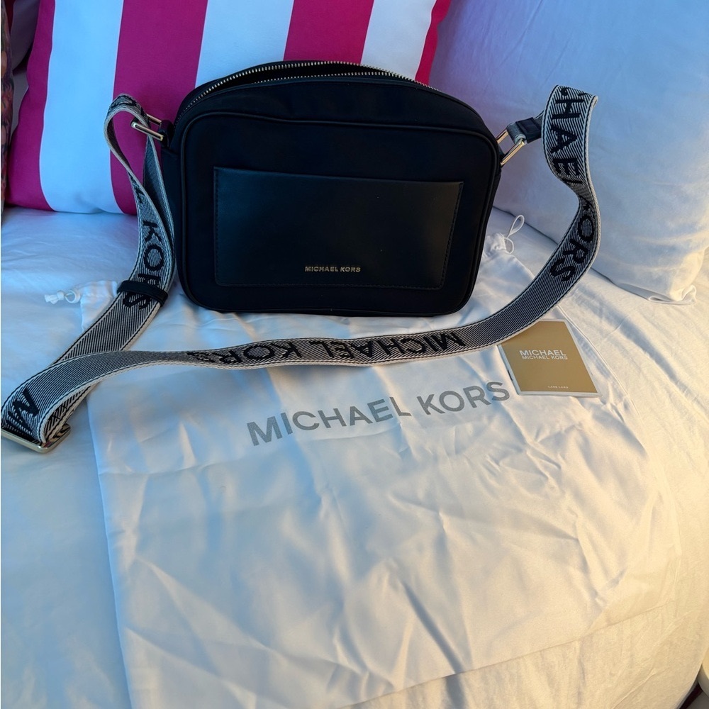 Michael Kors “East West pocket crossbody bag”with dust bag. New without tags
